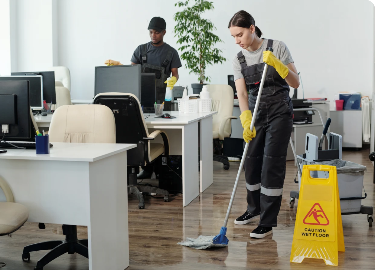 Office cleaning staff mopping floors